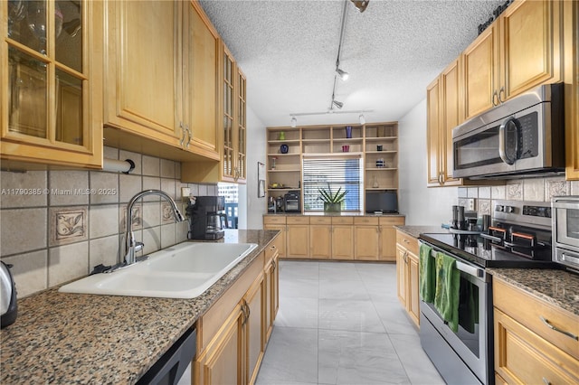 4001 Hillcrest Dr Unit 601, Hollywood, FL 33021 - kitchen with appliances with stainless steel finishes, light marble finish flooring, decorative backsplash, dark stone countertops, and a textured ceiling