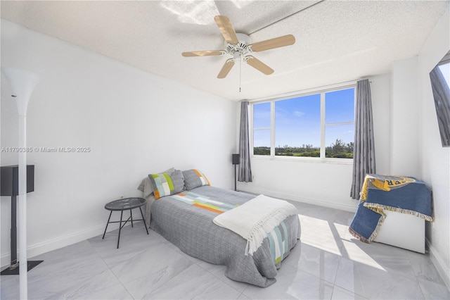 4001 Hillcrest Dr Unit 601, Hollywood, FL 33021 - bedroom with multiple windows, marble look tile flooring, ceiling fan, and a textured ceiling