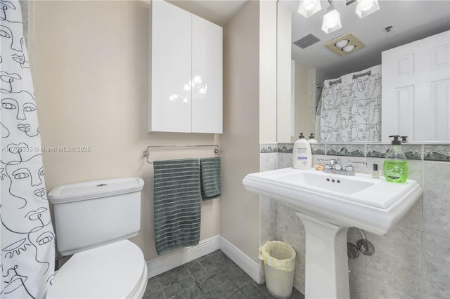4001 Hillcrest Dr Unit 601, Hollywood, FL 33021 - bathroom with tile walls, tile patterned floors, and a shower with curtain