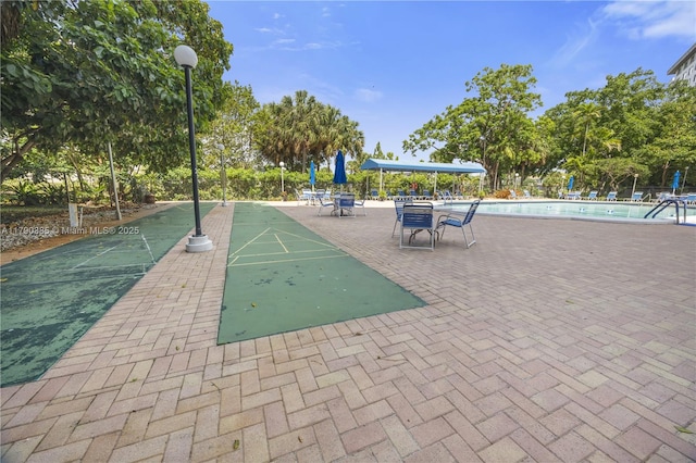 4001 Hillcrest Dr Unit 601, Hollywood, FL 33021 - view of property's community with a pool and shuffleboard