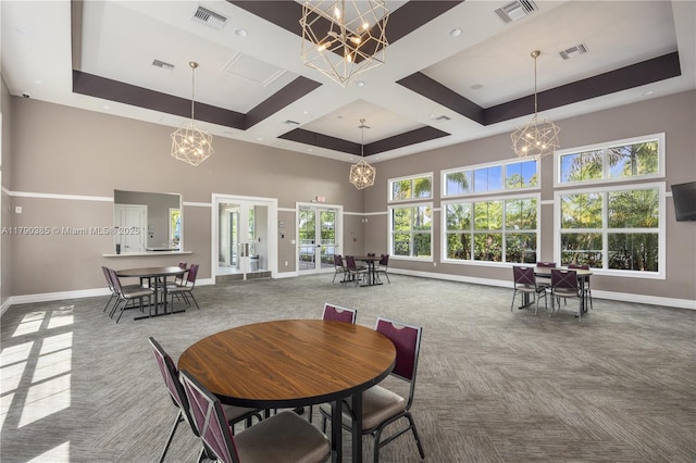 4001 Hillcrest Dr Unit 601, Hollywood, FL 33021 - dining space featuring a chandelier, a high ceiling, carpet floors, french doors, and coffered ceiling