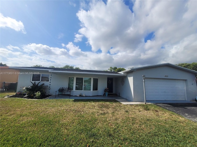 single story home with a front yard, an attached garage, stucco siding, and driveway