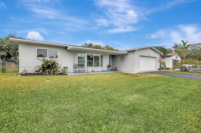 9460 NW 3rd St, Pembroke Pines, FL 33024 - ranch-style house with an attached garage, asphalt driveway, and stucco siding