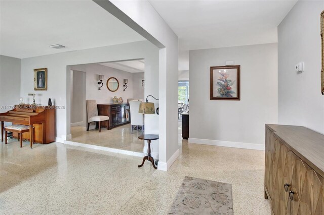 9460 NW 3rd St, Pembroke Pines, FL 33024 - hallway with dark speckled floor and baseboards
