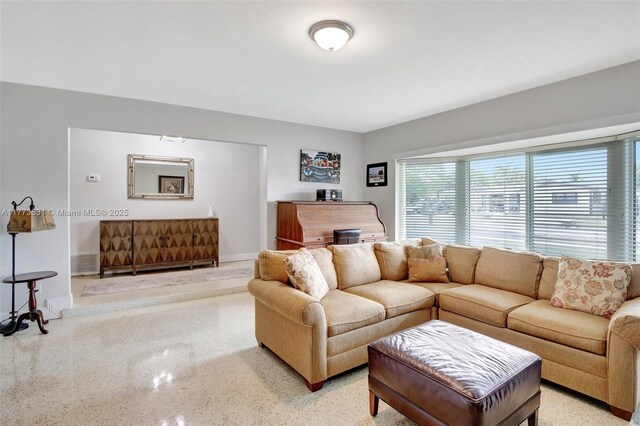 9460 NW 3rd St, Pembroke Pines, FL 33024 - living area featuring dark speckled floor and baseboards