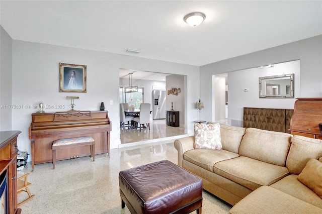 9460 NW 3rd St, Pembroke Pines, FL 33024 - living area featuring speckled floor and a chandelier
