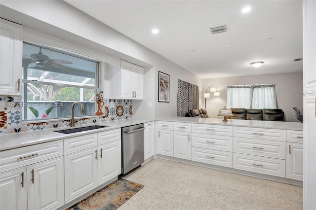 9460 NW 3rd St, Pembroke Pines, FL 33024 - kitchen with a sink, stainless steel dishwasher, a ceiling fan, light countertops, and white cabinetry