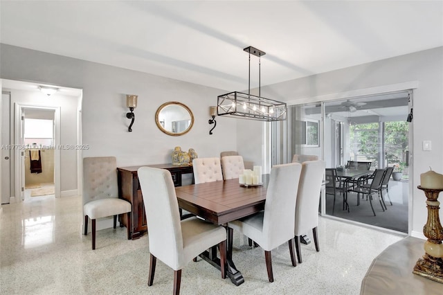 9460 NW 3rd St, Pembroke Pines, FL 33024 - dining room featuring dark speckled floor and baseboards