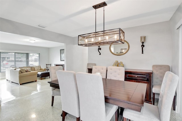 9460 NW 3rd St, Pembroke Pines, FL 33024 - dining room featuring speckled floor and a chandelier