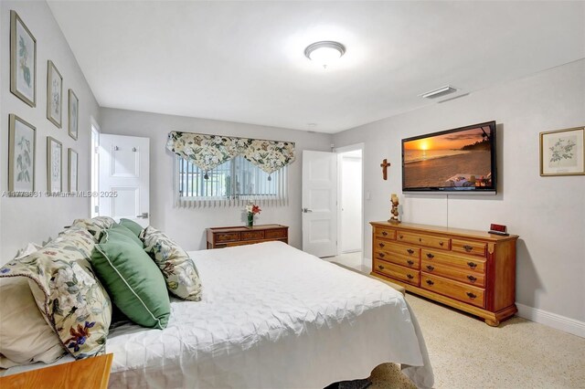 9460 NW 3rd St, Pembroke Pines, FL 33024 - bedroom featuring baseboards and speckle patterned floor