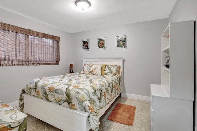9460 NW 3rd St, Pembroke Pines, FL 33024 - bedroom with baseboards and dark aggregate flooring