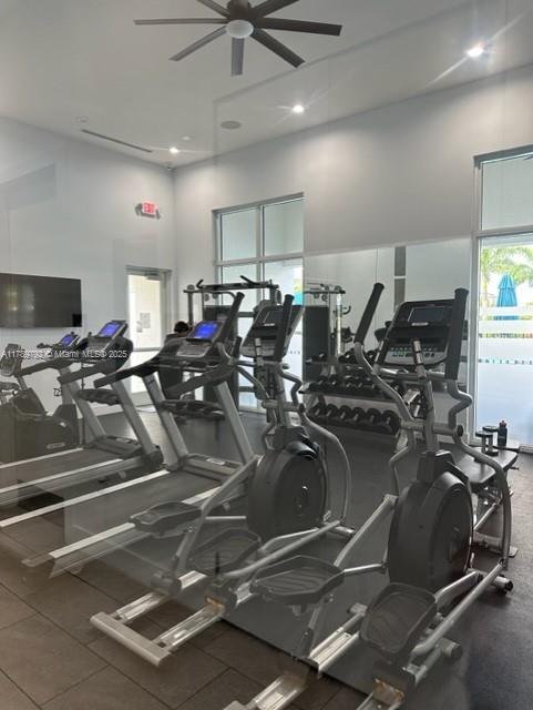 exercise room with recessed lighting and ceiling fan