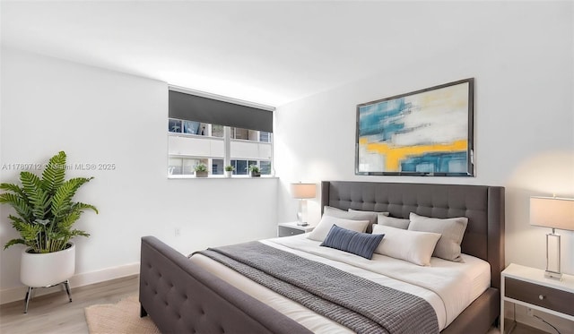 840 NW 87th Ave Unit 204, Miami, FL 33172 - bedroom featuring baseboards and wood finished floors