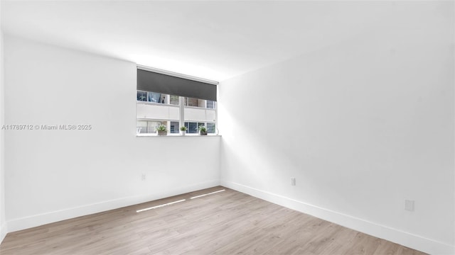 840 NW 87th Ave Unit 204, Miami, FL 33172 - unfurnished room featuring wood finished floors and baseboards