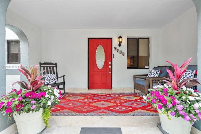 view of exterior entry featuring stucco siding