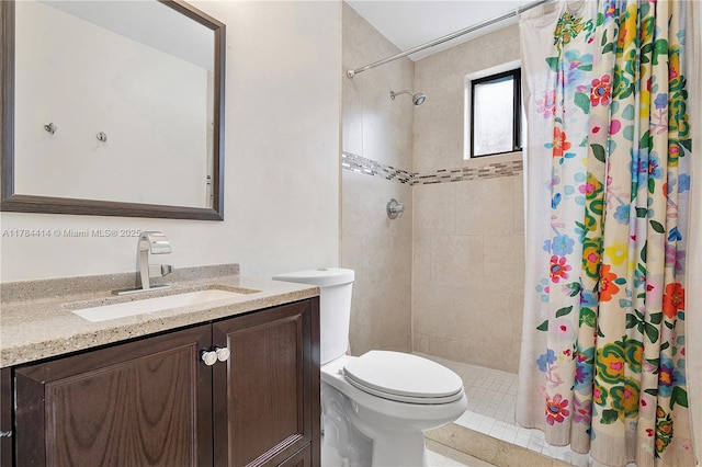 full bath with a tile shower, toilet, and vanity