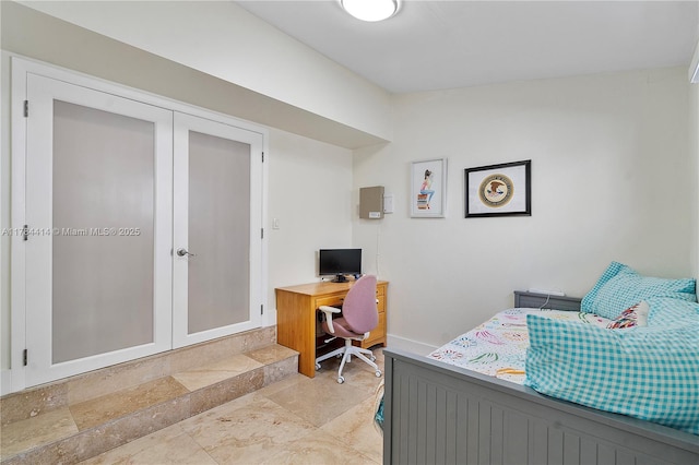 bedroom featuring baseboards