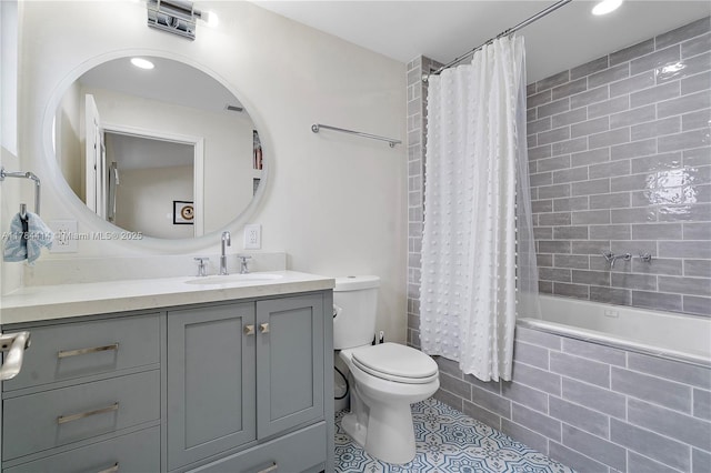 full bath with recessed lighting, tile patterned flooring, tiled shower / bath, toilet, and vanity