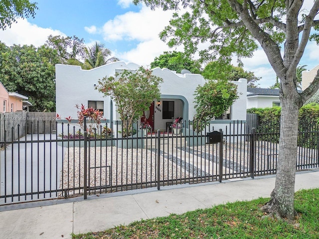 view of gate featuring a fenced front yard