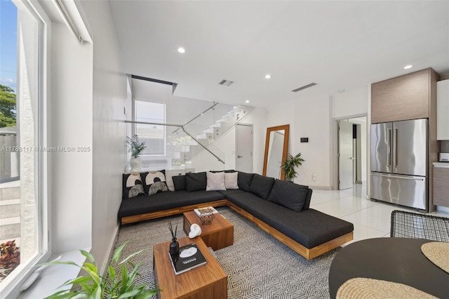 2615 NE 213th St, Miami, FL 33180 - living room featuring recessed lighting, plenty of natural light, stairway, and light tile patterned floors