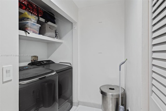 laundry room with washer and dryer and laundry area