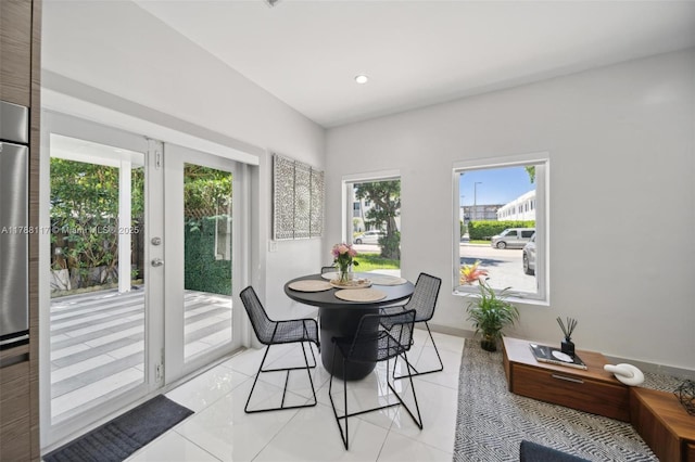 2615 NE 213th St, Miami, FL 33180 - dining space with healthy amount of natural light, light tile patterned floors, recessed lighting, and french doors