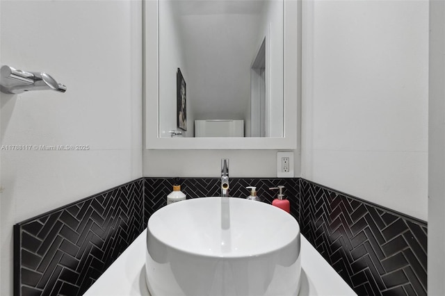 2615 NE 213th St, Miami, FL 33180 - bathroom featuring a sink and tile walls