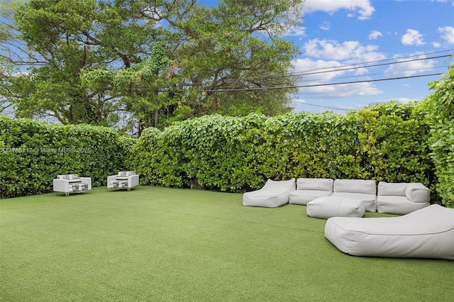 2615 NE 213th St, Miami, FL 33180 - view of grassy yard featuring an outdoor living space