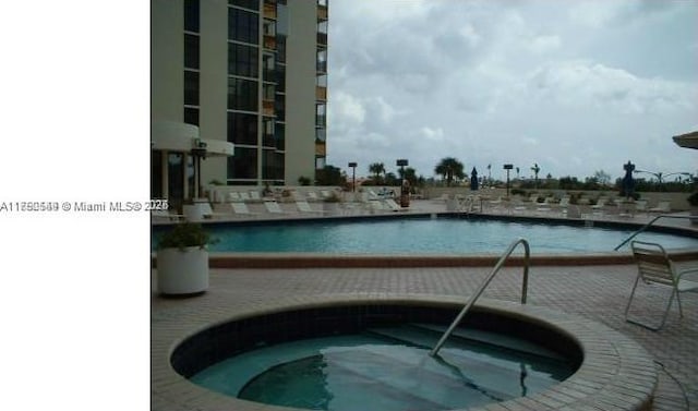 pool with a community hot tub