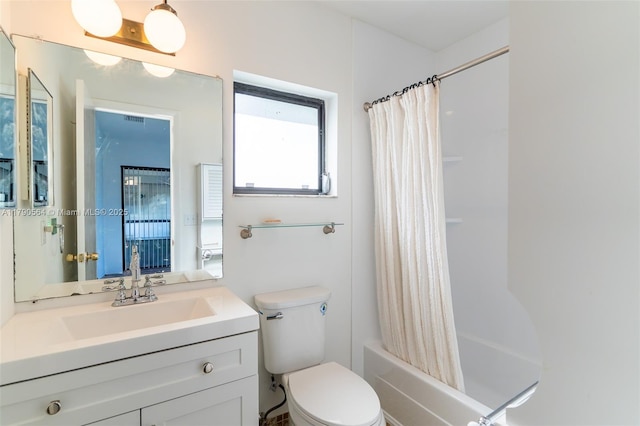 bathroom with vanity, shower / tub combo, and toilet