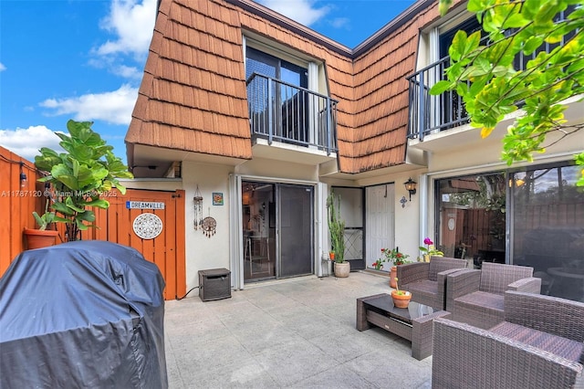 9153 SW 23rd St Unit D, Davie, FL 33324 - back of property with a patio area, a balcony, and stucco siding