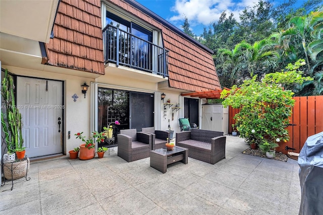 9153 SW 23rd St Unit D, Davie, FL 33324 - view of patio / terrace with fence, outdoor lounge area, and a balcony