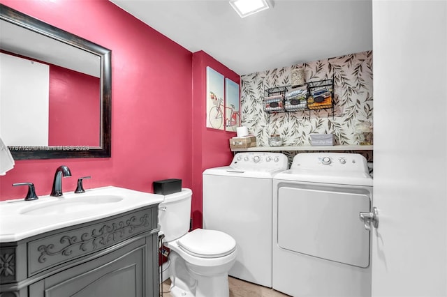 9153 SW 23rd St Unit D, Davie, FL 33324 - bathroom featuring washing machine and clothes dryer, toilet, and vanity