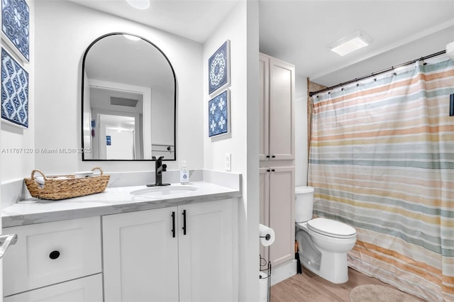 9153 SW 23rd St Unit D, Davie, FL 33324 - bathroom featuring a shower with curtain, toilet, visible vents, wood finished floors, and vanity
