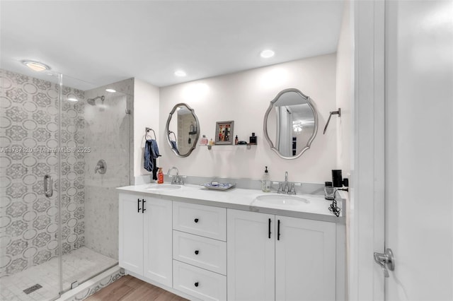 9153 SW 23rd St Unit D, Davie, FL 33324 - full bath featuring wood finished floors, a sink, a shower stall, and double vanity