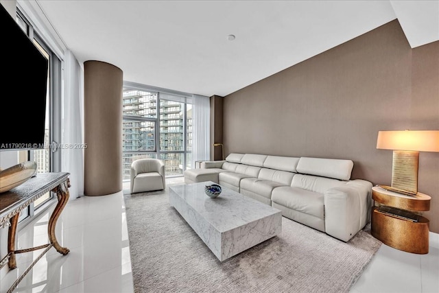 living room featuring floor to ceiling windows
