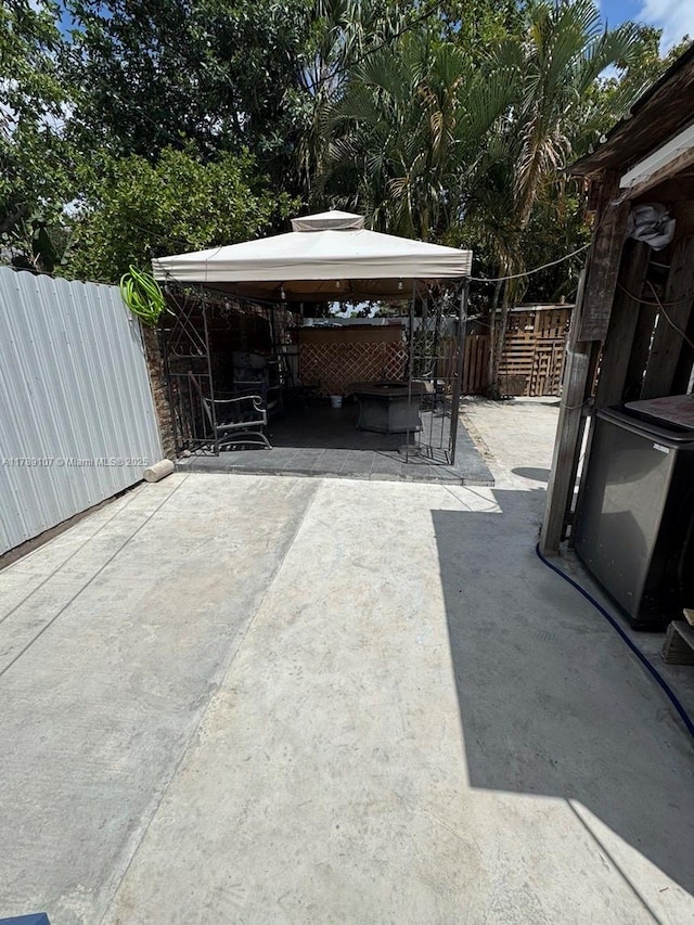 view of patio with a gazebo and a fenced backyard
