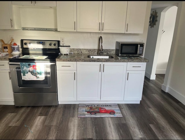 kitchen featuring a sink, white cabinets, appliances with stainless steel finishes, and dark wood-style flooring