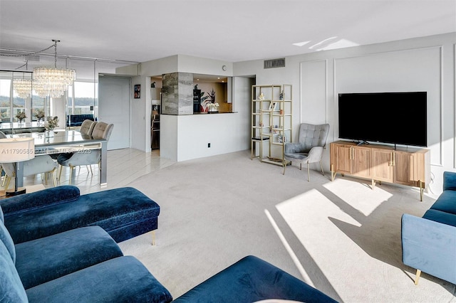 100 Bayview Unit 617, Sunny Isles Beach, FL 33160 - living area with a chandelier and carpet floors