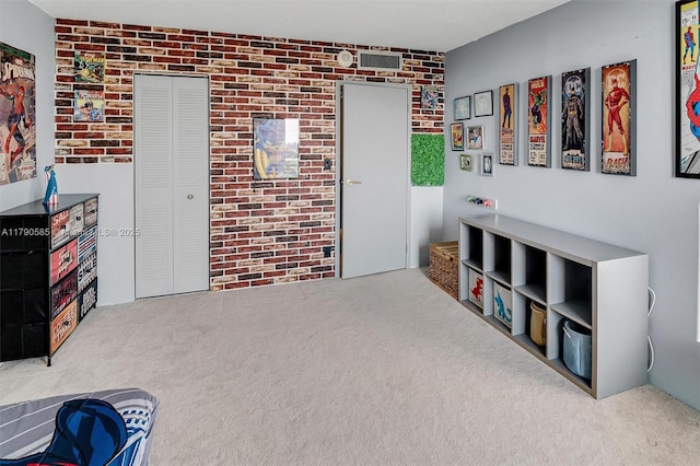 100 Bayview Unit 617, Sunny Isles Beach, FL 33160 - sitting room with carpet floors and brick wall
