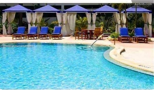 community pool with a patio