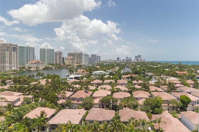 bird's eye view featuring a residential view, a water view, and a view of city