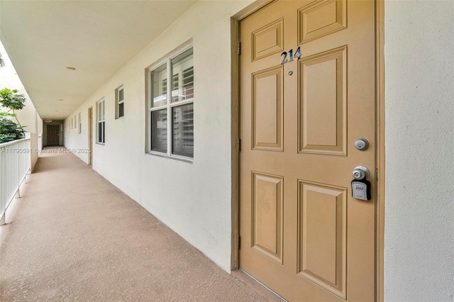 1810 New Palm Way Unit 214, Boynton Beach, FL 33435 - property entrance with stucco siding