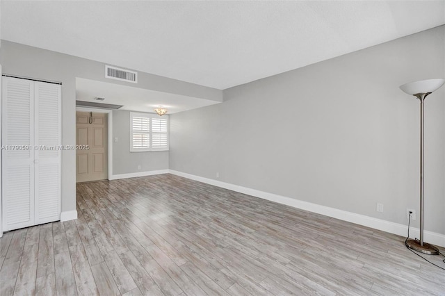 1810 New Palm Way Unit 214, Boynton Beach, FL 33435 - unfurnished bedroom featuring light wood-type flooring and baseboards