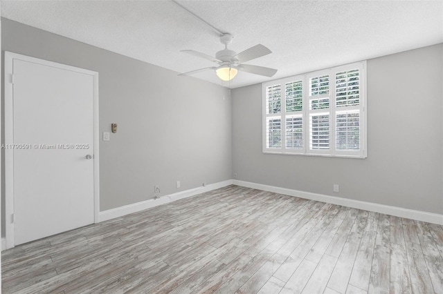 1810 New Palm Way Unit 214, Boynton Beach, FL 33435 - empty room with a textured ceiling, wood finished floors, a ceiling fan, and baseboards