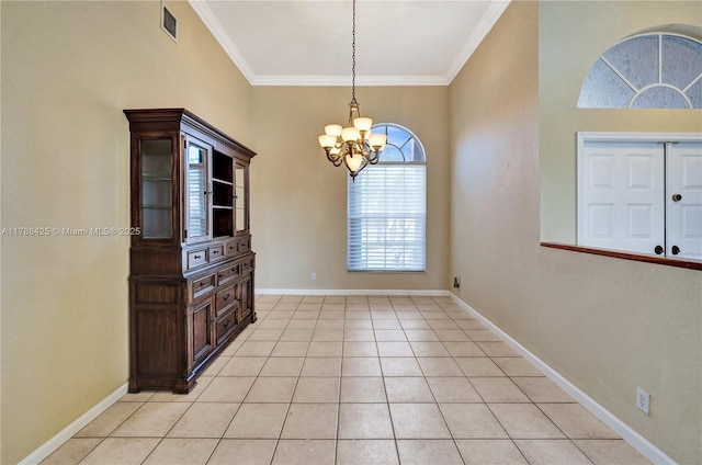 unfurnished dining area with ornamental molding, an inviting chandelier, light tile patterned floors, and baseboards
