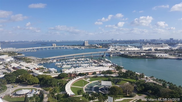 birds eye view of property featuring a water view and a city view