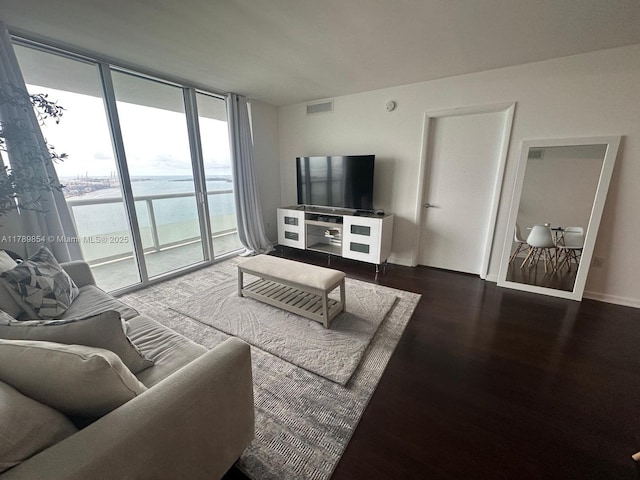 50 Biscayne Blvd Unit 3308, Miami, FL 33132 - living room with expansive windows, baseboards, visible vents, and wood finished floors