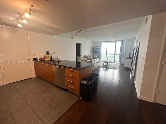 50 Biscayne Blvd Unit 3308, Miami, FL 33132 - kitchen with rail lighting, dark countertops, a peninsula, and dishwasher