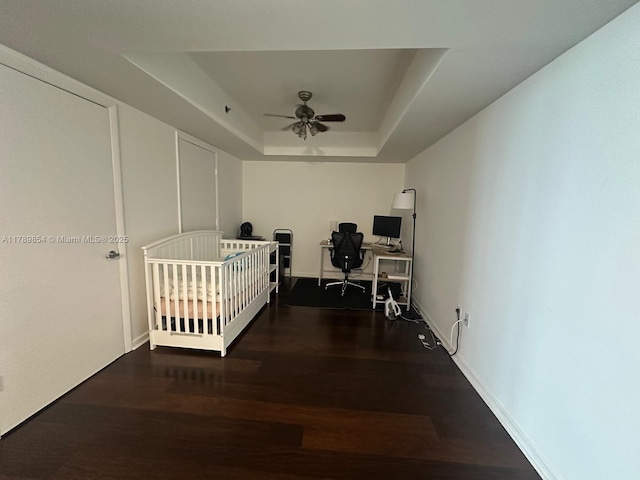 50 Biscayne Blvd Unit 3308, Miami, FL 33132 - bedroom featuring a ceiling fan, baseboards, wood finished floors, and a raised ceiling